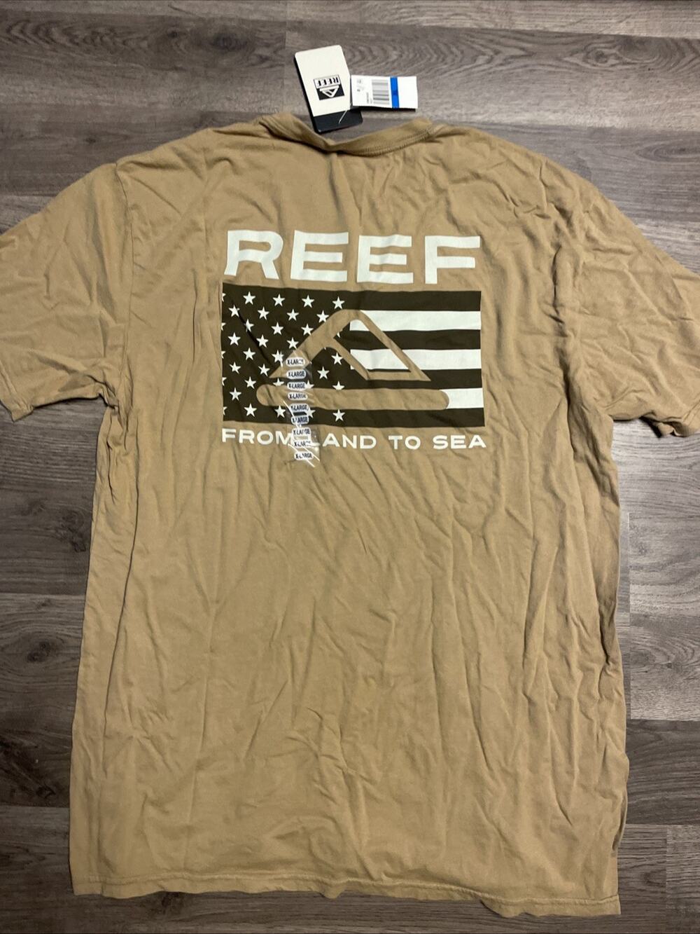 NWT REEF Men’s T-Shirt Tan Khaki Bondi From Land To Sea Flag Graphic Size XL